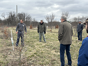 Advisory Committee members and staff looking at the growth of the plantations at Lugar Farm.